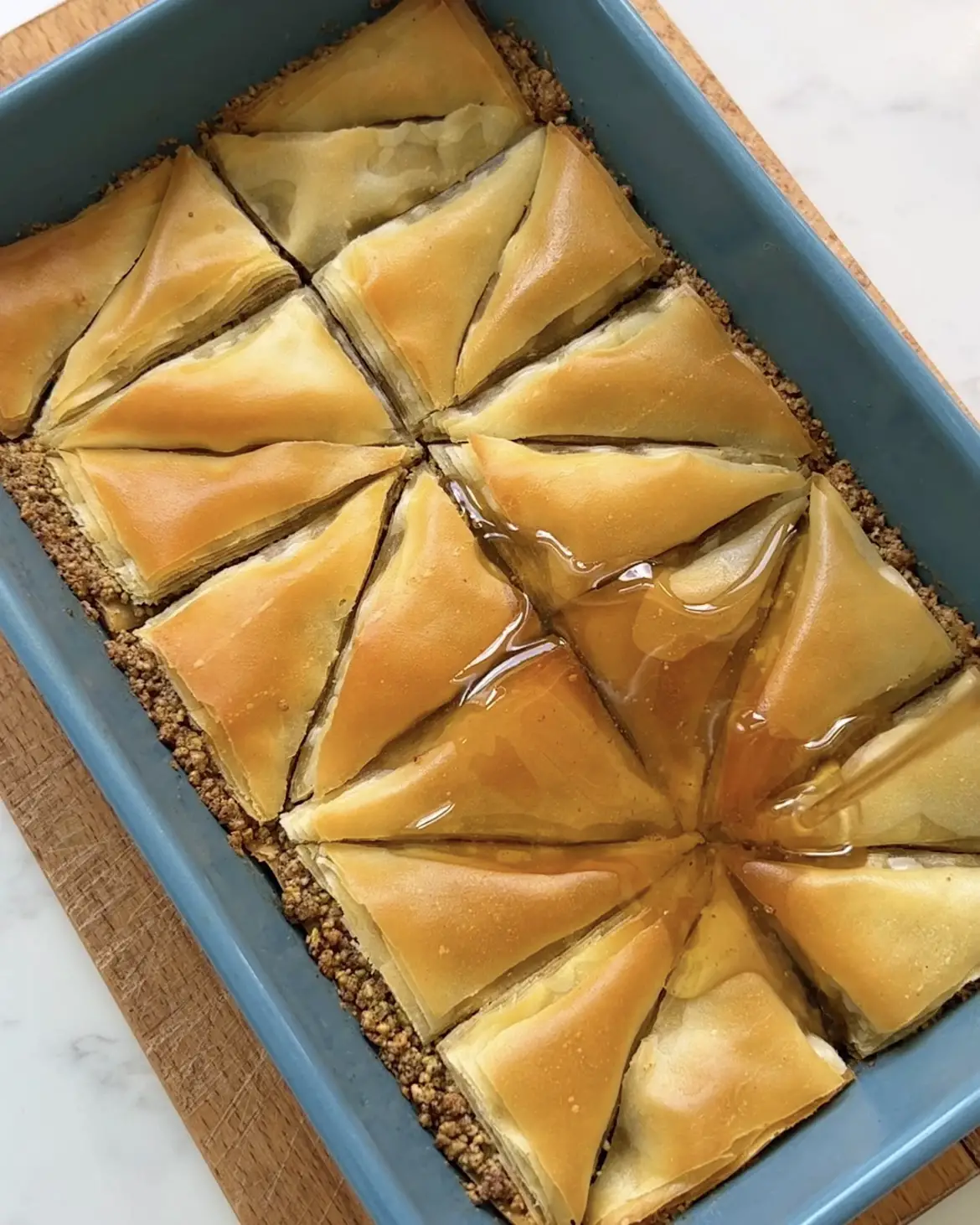 add the syrup to the baklava